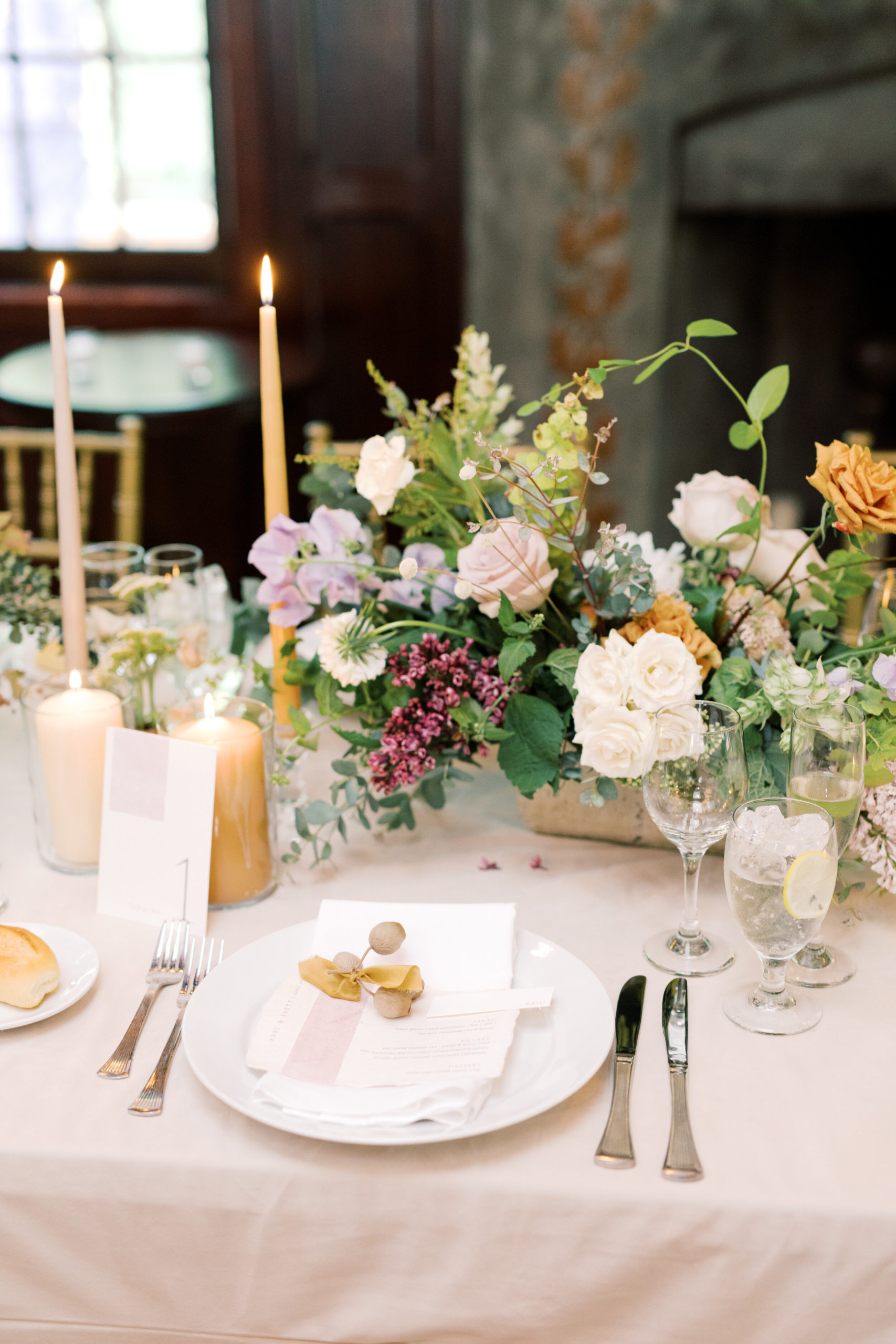 Pastel wedding tabletop with taper candles